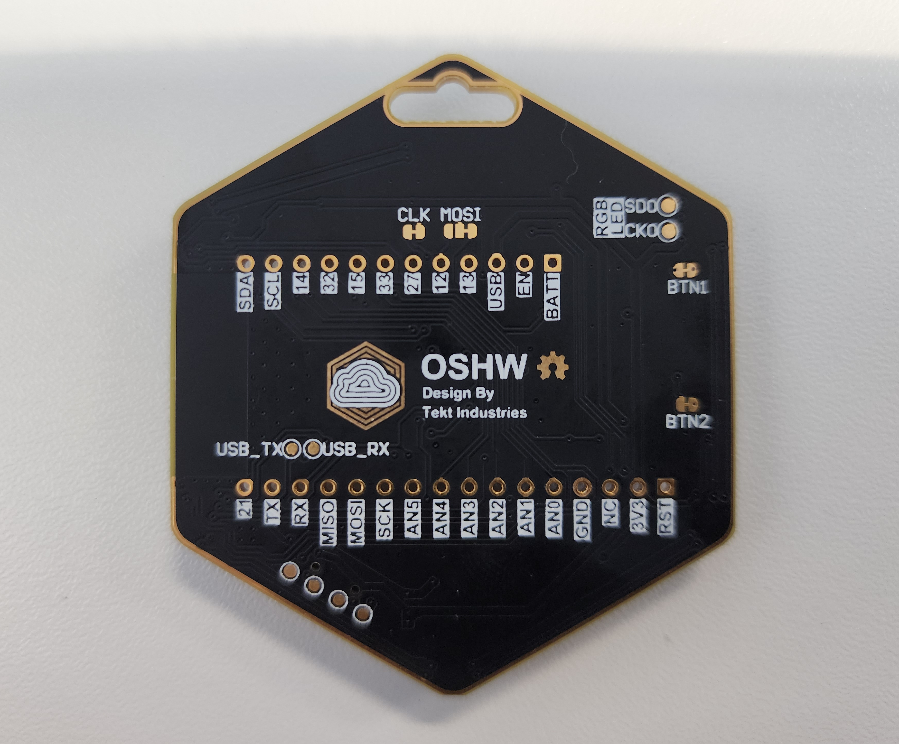 Back of the ESP32 badge showing the WROOM-32 module and CP2104 USB-to-UART bridge